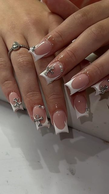 Sophisticated French Tip Nail Design with Nude Base and Glamorous Silver Accents.