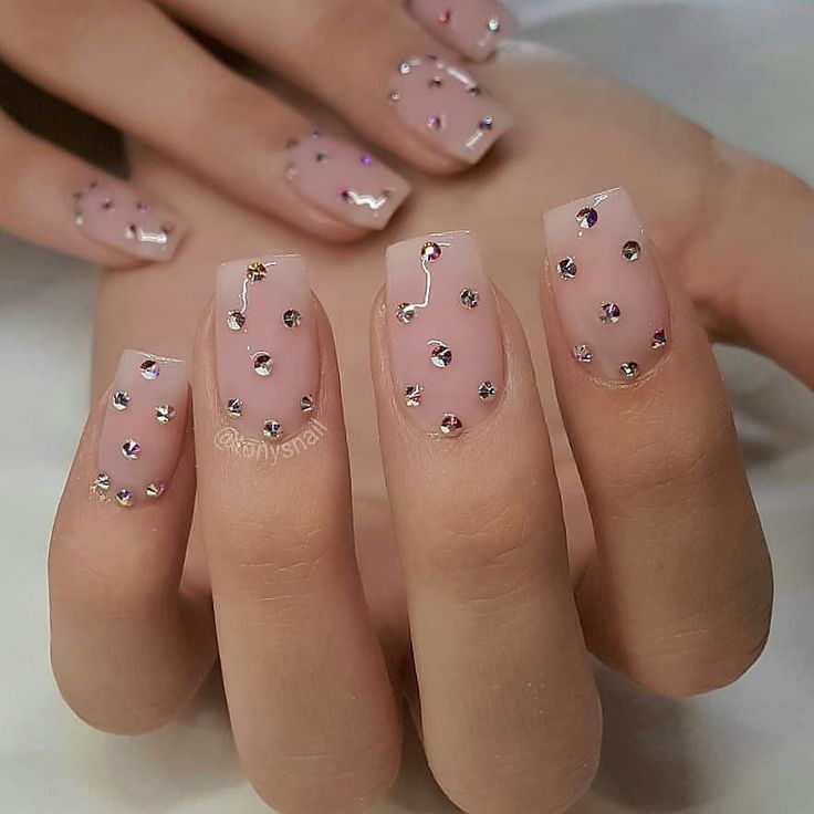 Elegant Soft Pink Nail Design with Shimmering Rhinestones for a Glamorous Touch.