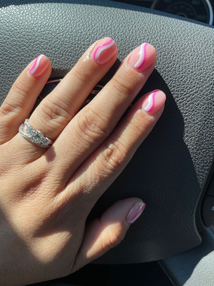 Chic Elegant Pink Nail Design: Playful Curves with Glossy Finish and Delicate Accents.