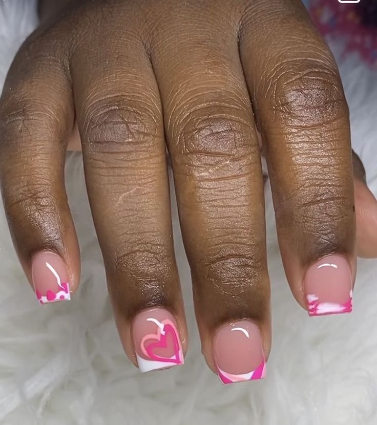 Charming Pink and White Nail Design with Heart Motifs and Vibrant Accents.