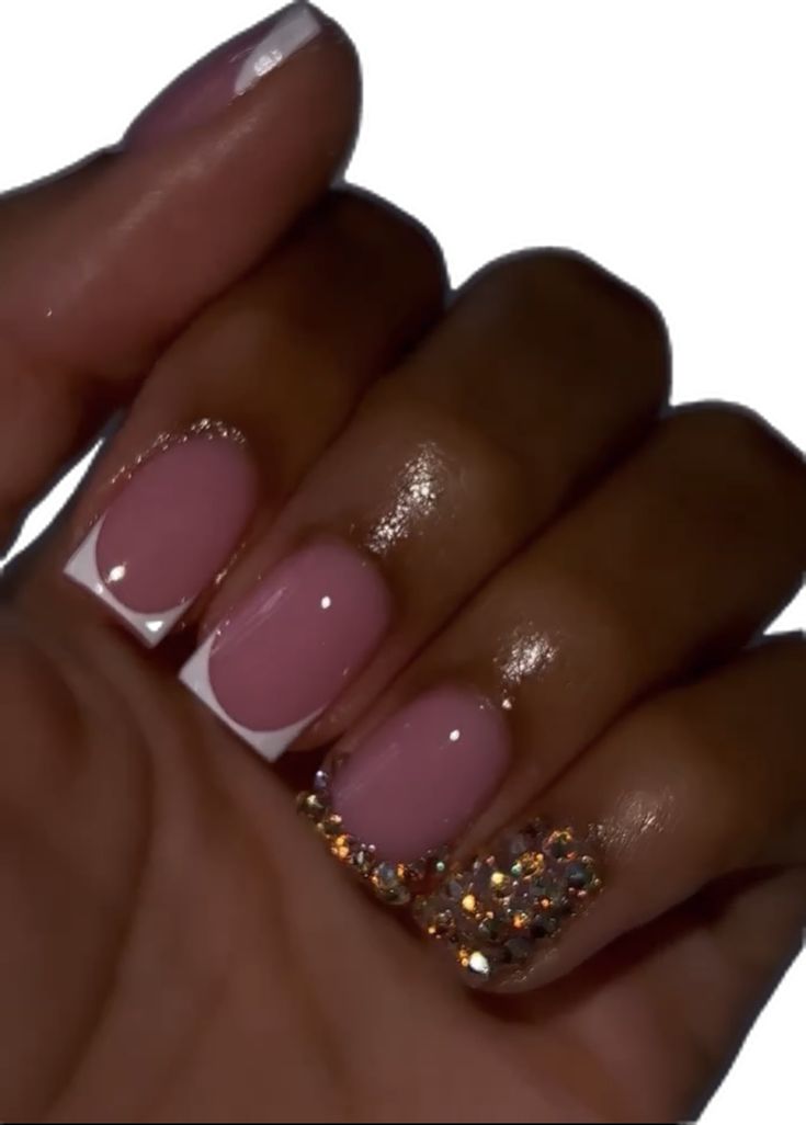 Chic French Tip Nail Design with Soft Pink Base and Glamorous Rhinestone Accent.