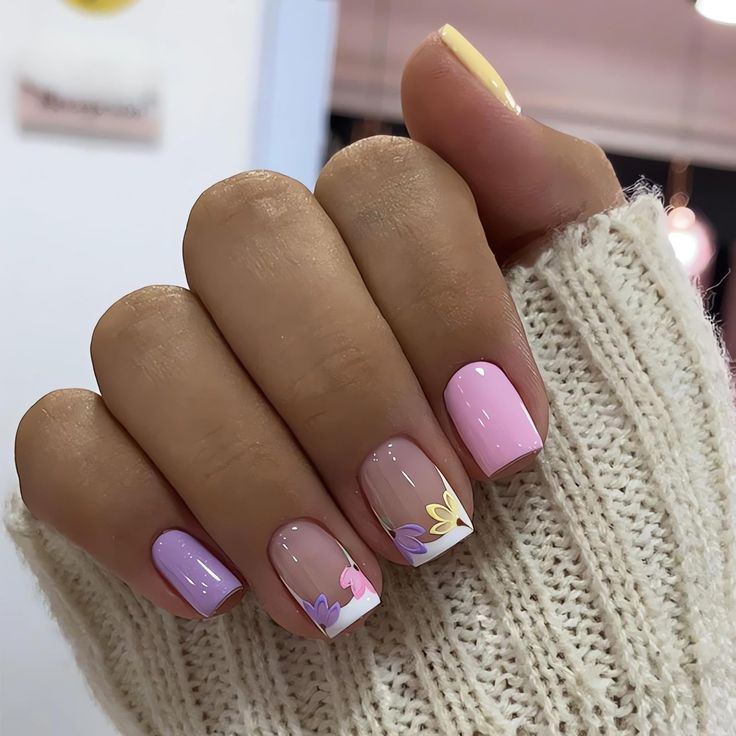 Chic Floral Nail Design in Soft Pink and Lavender for a Whimsical Touch.