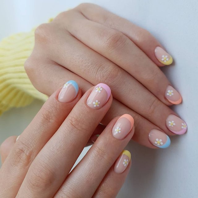 Cheerful Bright Pastel Nail Design with Floral Accents for Spring/Summer Vibes.