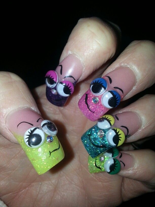 Playful and Vibrant Whimsical Nail Art with Googly Eyes and Sparkly Accents