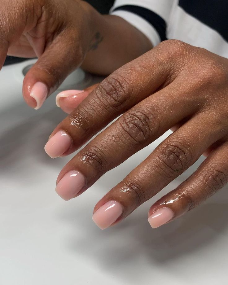 Elegant Natural Nude Manicure with Soft Pink Base and Classic Rounded Tips.