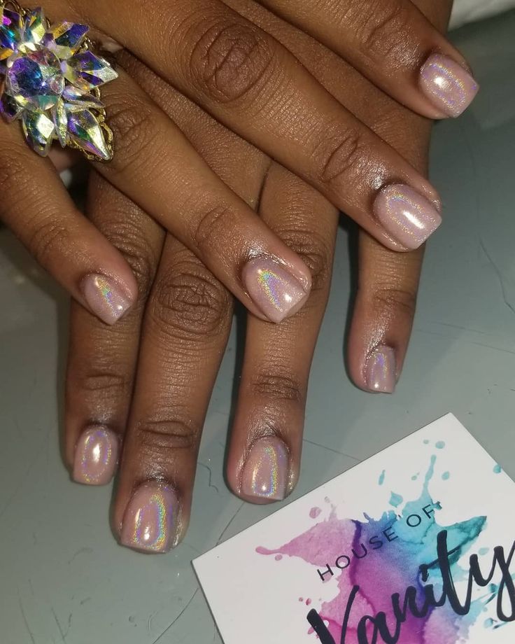 Chic Iridescent Nail Art: Soft Nude Base with Holographic Accents.