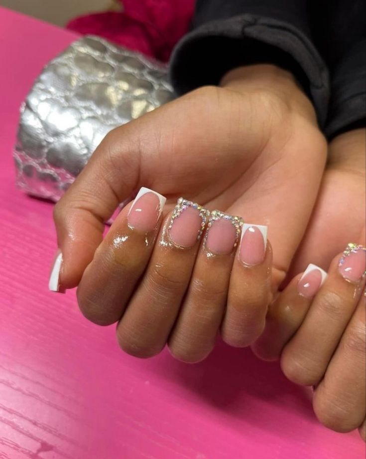 Timeless French Tip Nails with Glamorous Silver Accents on a Subtle Pink Base.