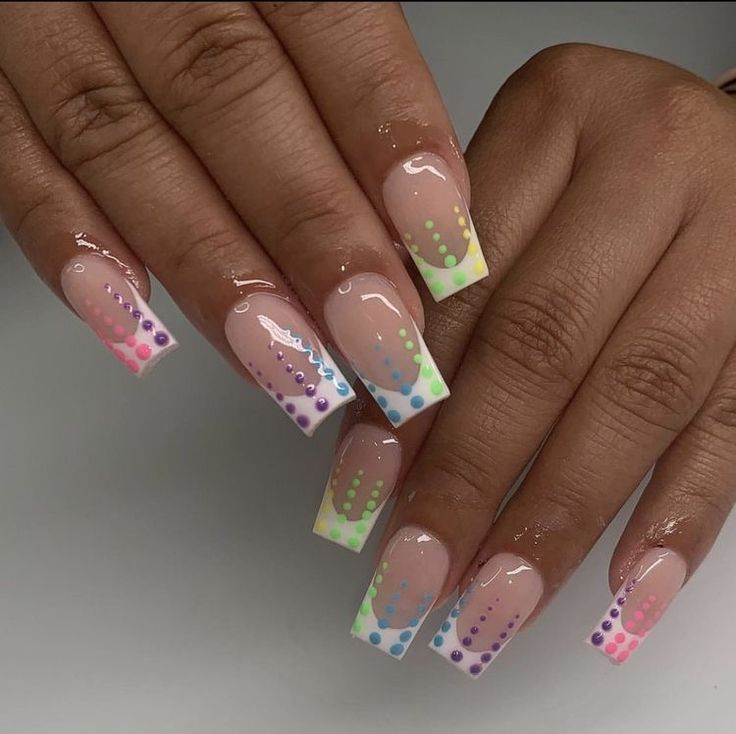 Vibrant Ombre Nail Design with Nude Base and Neon Dots for a Playful, Elegant Look.