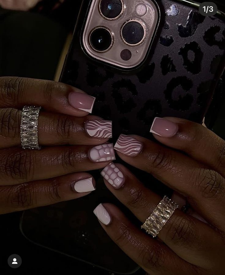 Luxurious Elegant Nail Design with Soft Pink Shades and Artistic Patterns