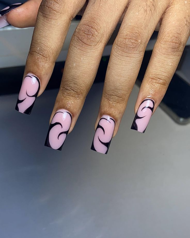 Elegant Nail Design: Modern Wave Pattern in Soft Pink and Bold Black