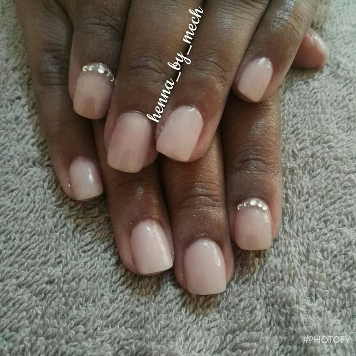 Sophisticated Elegant Nude Nails with Delicate Pearl Accents