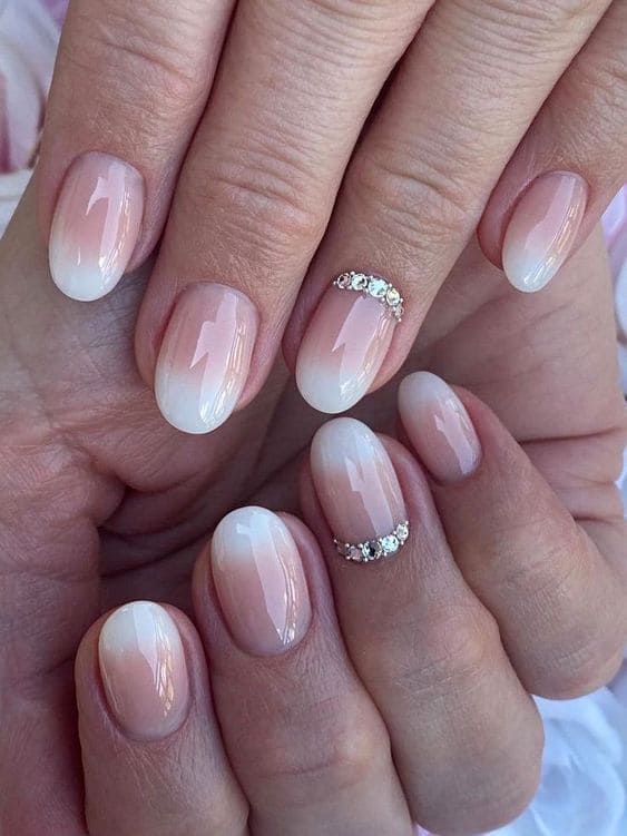 Sophisticated Ombre Nails with Glamorous Rhinestone Accents.