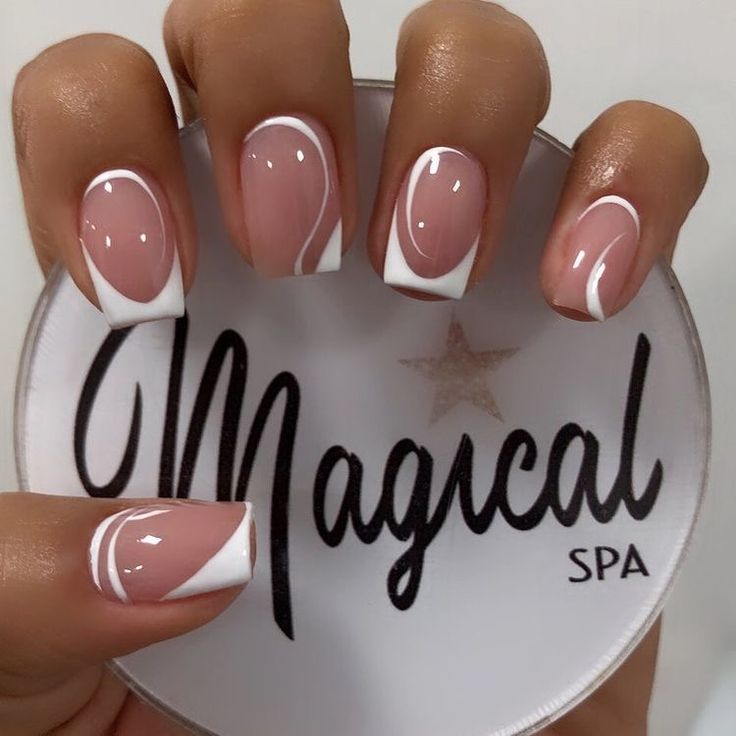 Sophisticated Nude Nail Design with White Tips and Artistic Swirls