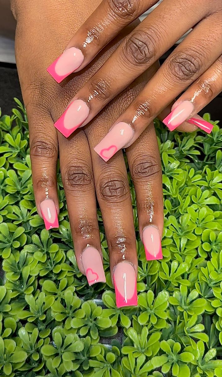 Chic Nail Design: Soft and Neon Pink with Heart Accents for Any Occasion.