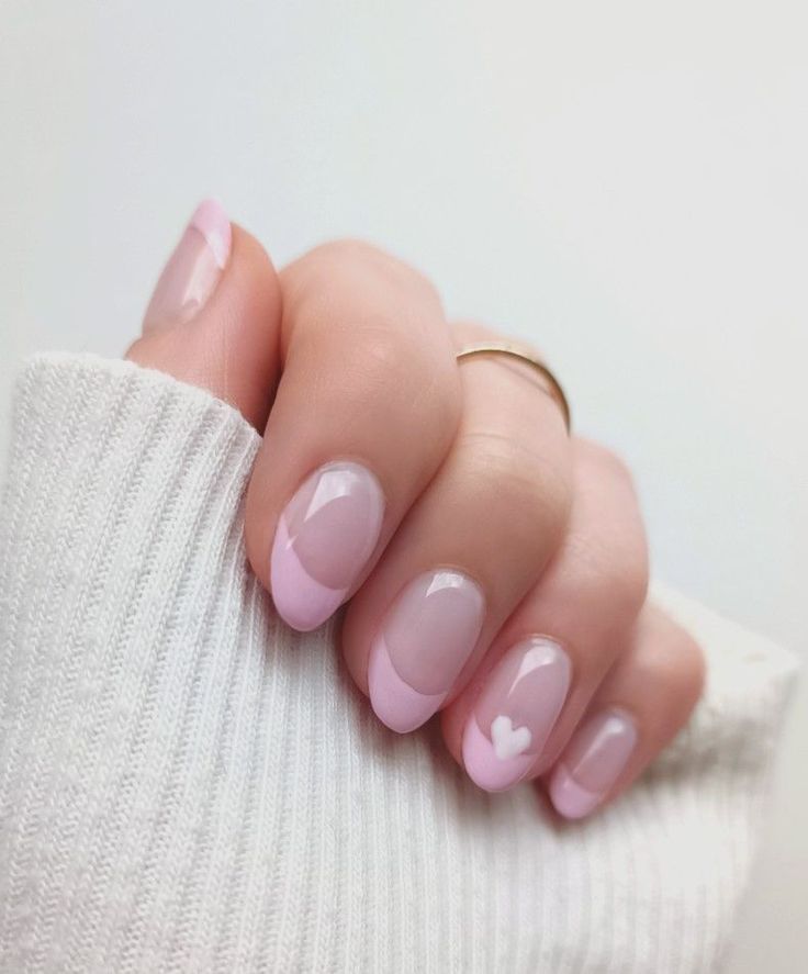 Delicate Heart-Motif French Tip Nail Design: A Fresh and Romantic Elegance.