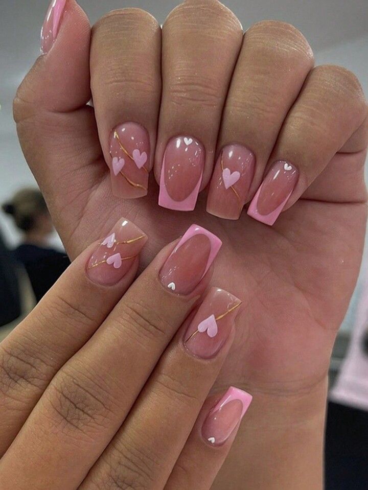 Soft Translucent Nail Design with Pink French Tips and Charming Heart Motifs