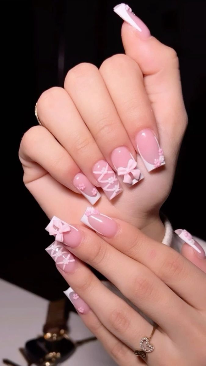 Charming Elegant Nail Design with Soft Pink Tones and Intricate White Accents