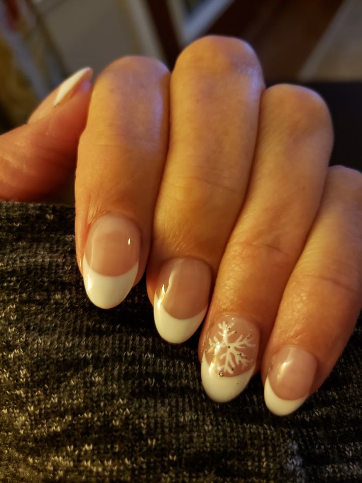 Elegant Winter-Inspired French Tip Nail Design with Snowflake Accent