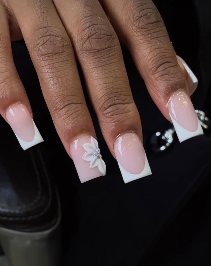 Chic Coffin-Shaped Nail Design: Soft Pink and White with 3D Floral Accents.