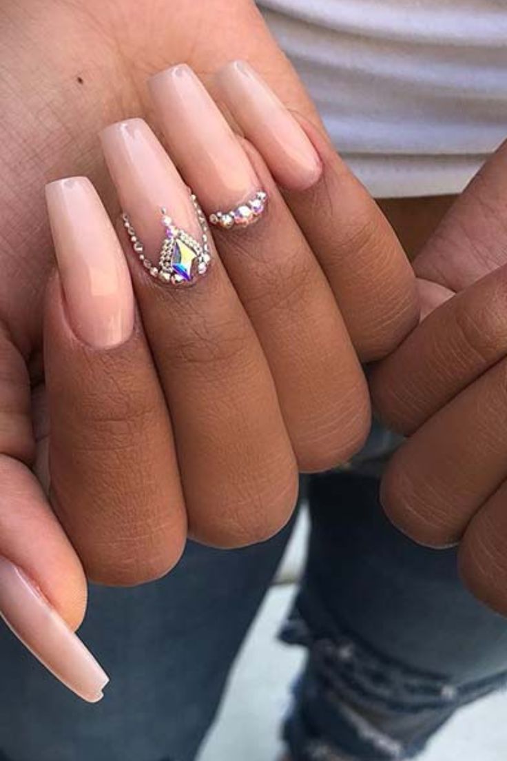 Chic Elegant Nude Nail Design with Rhinestone Accents for Versatile Occasions.