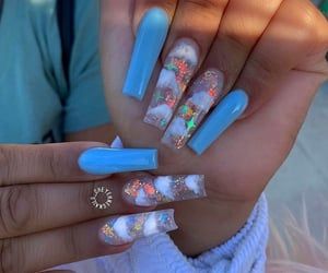 Whimsical Light Blue Nail Design with Glittery Accent Nails