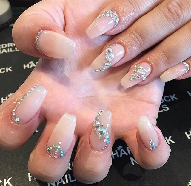 Sophisticated Almond-Shaped Nails: Soft Nude Base with Sparkling Rhinestone Embellishments