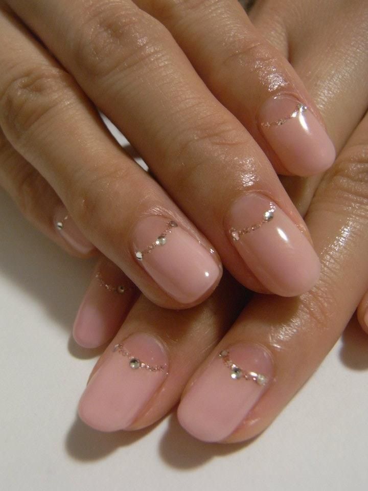 Sophisticated Nail Design with Soft Pink Base and Glamorous Glittering Beads