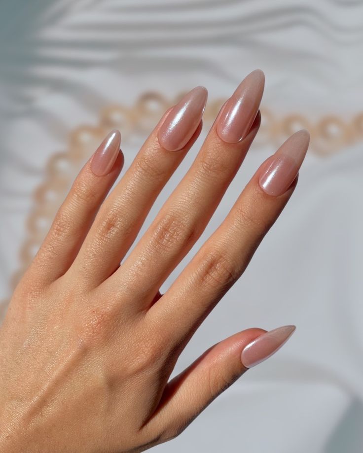 Chic Almond-Shaped Nails with Sophisticated Nude Polish for Understated Glamour