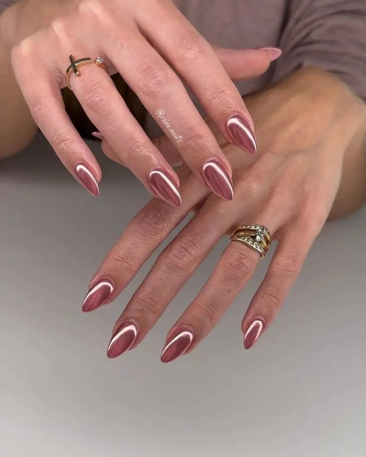 Chic Mauve Almond Nails with White Tips and Gold Accents.