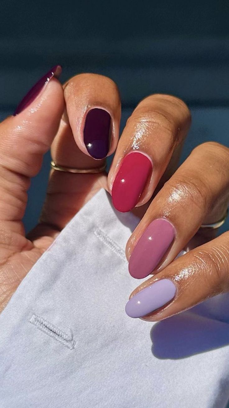 Sophisticated Nail Design: Deep Purple and Burgundy with Soft Pastels for a Striking Look.