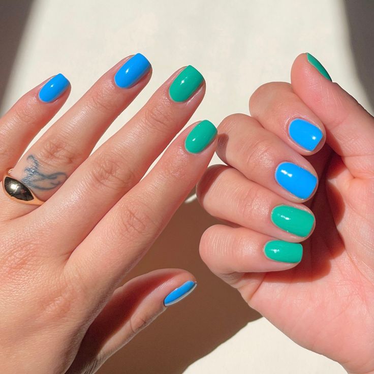 Vibrant Dual-Tone Nail Design: Eye-Catching Blue and Green Contrast for a Fresh Look.