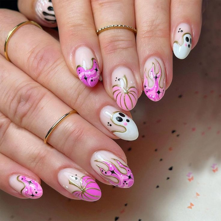 Playful Whimsical Nail Design with Ghost and Flame Motifs for Festive Celebrations.