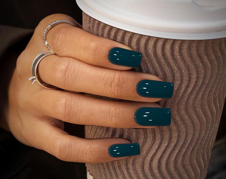 Chic Turquoise Nails with Glossy Finish and Minimalist Silver Rings.