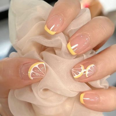 Citrusy Lemon-Themed Nail Design: Cheerful Yellow Tips and Hand-Painted Accents for a Bright Summer Vibe.