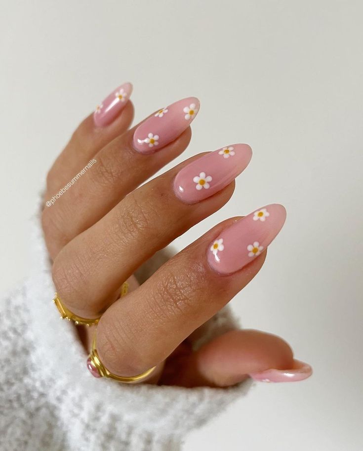 Charming Pink Floral Nails with Glossy Finish and Gold Ring Accents.