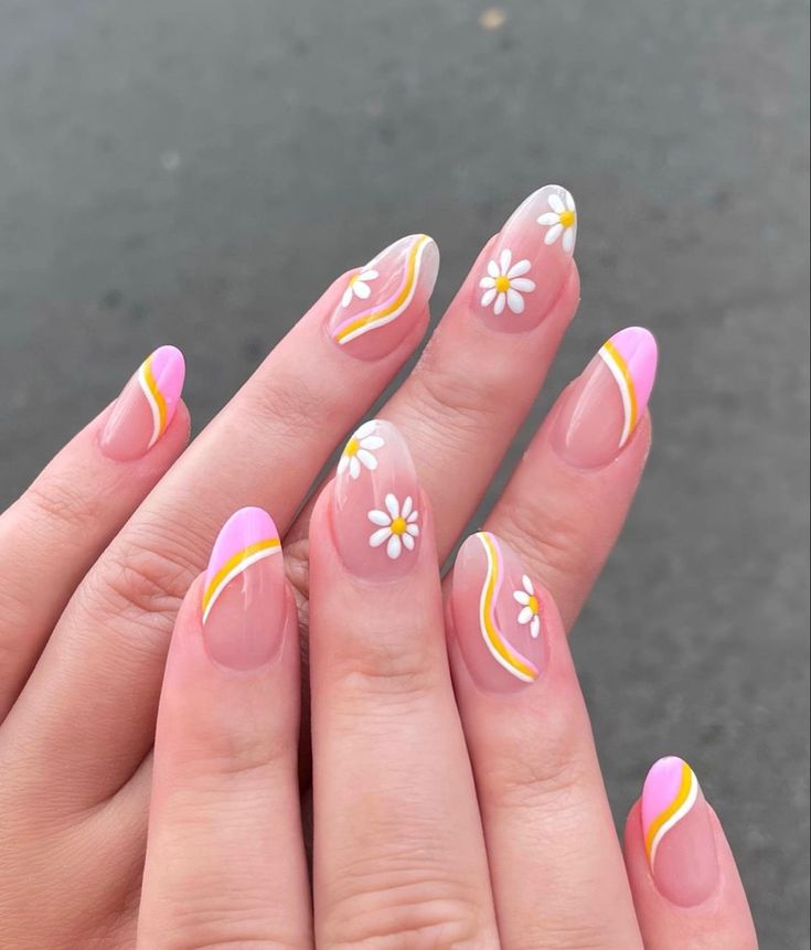 Charming Playful Nail Design with Pink Tips, Yellow Accents, and Floral Daisies.