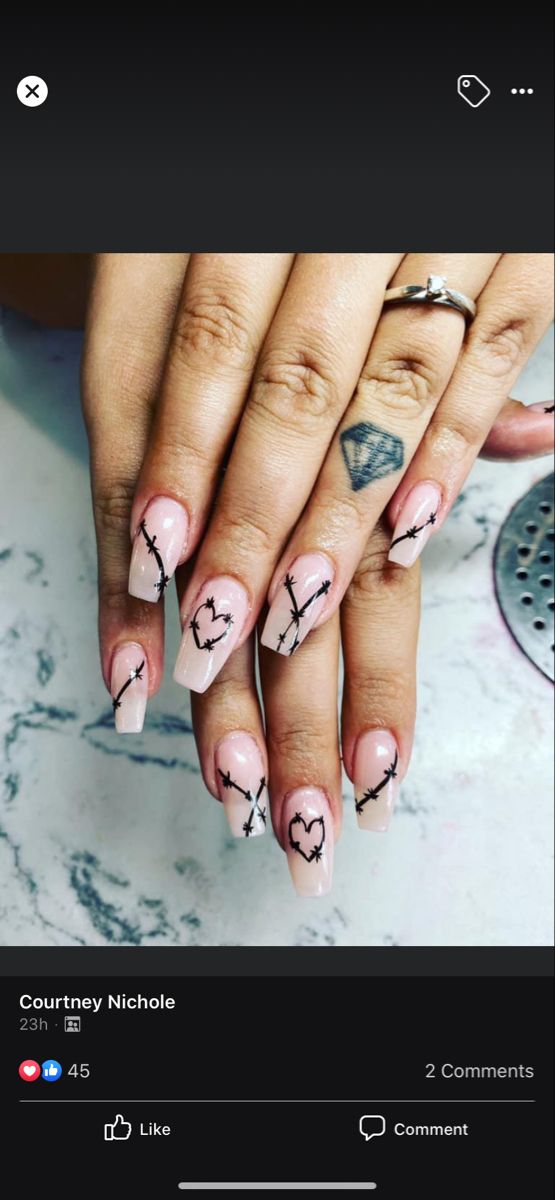 Edgy Soft Pink Gradient Nail Design with Intricate Black Line Art