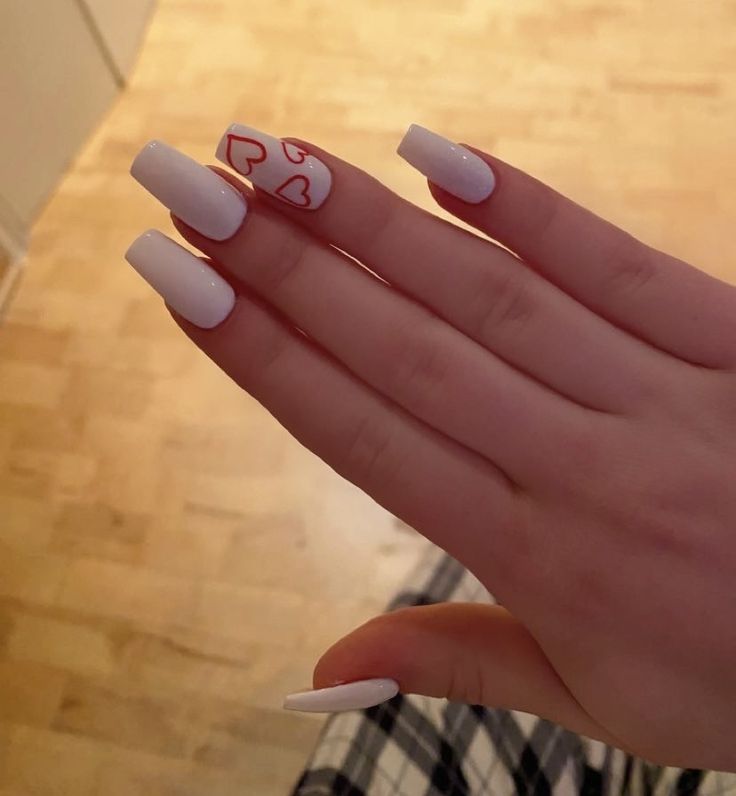 Chic White Glossy Long Nails with Whimsical Red Heart Accent