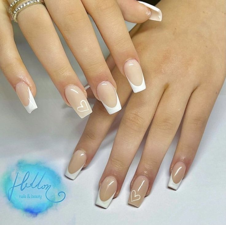 Chic Nude and White French Manicure with Minimalist Heart Accents.