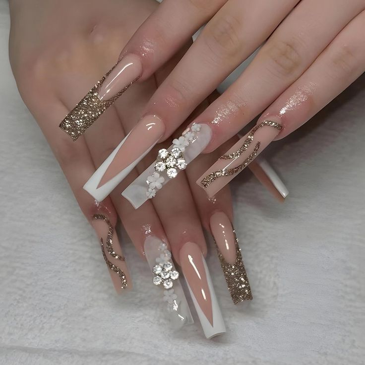 Elegant Luxurious Nail Design with Nude, White, and Glittery Gold Accents