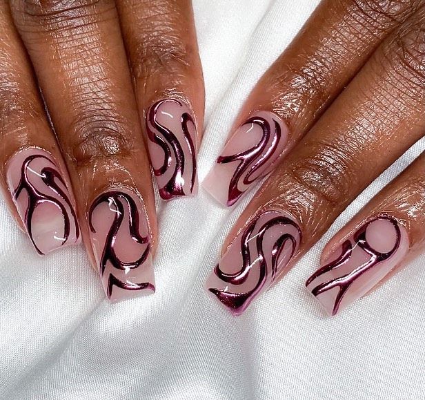 Elegant Nail Design: Soft Pink and Deep Burgundy Swirls on a Neutral Base.