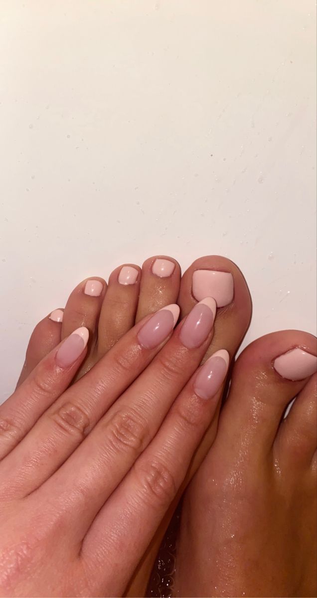 Sophisticated Nail Design in Soft Pink and Nude Palette with Coordinated French Tips.