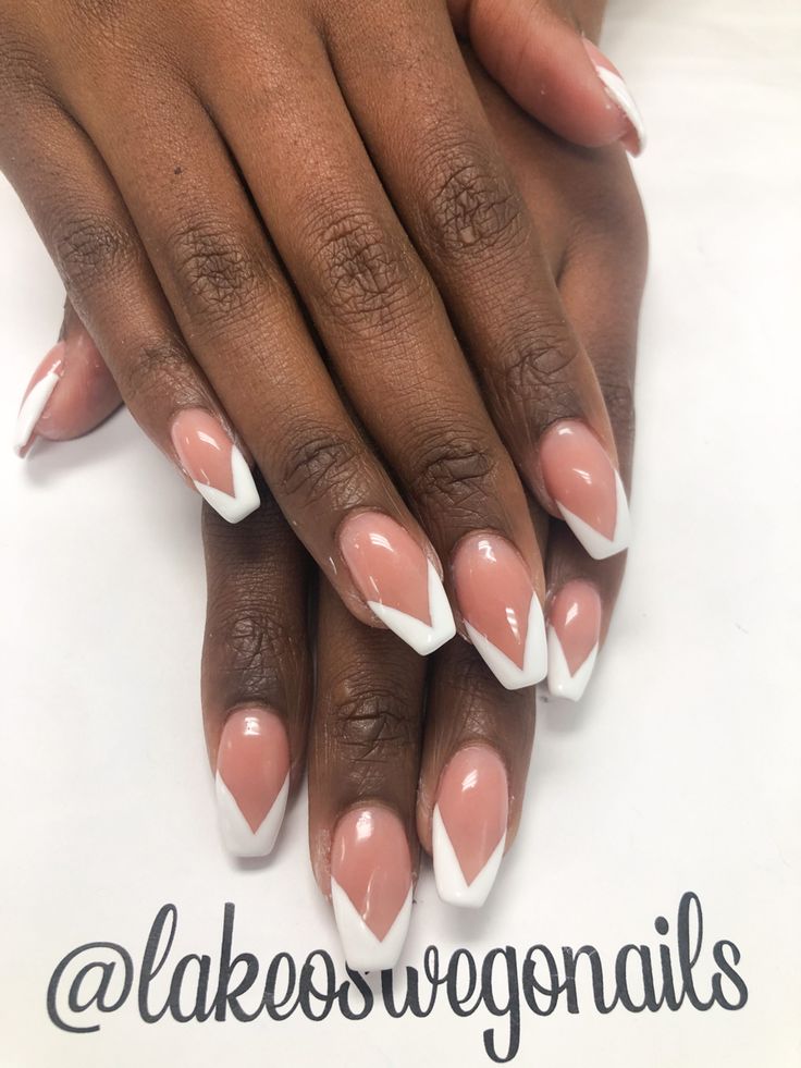 Chic French Tip Nail Design: Soft Pink Base with Sharp White Tips for Sophistication.