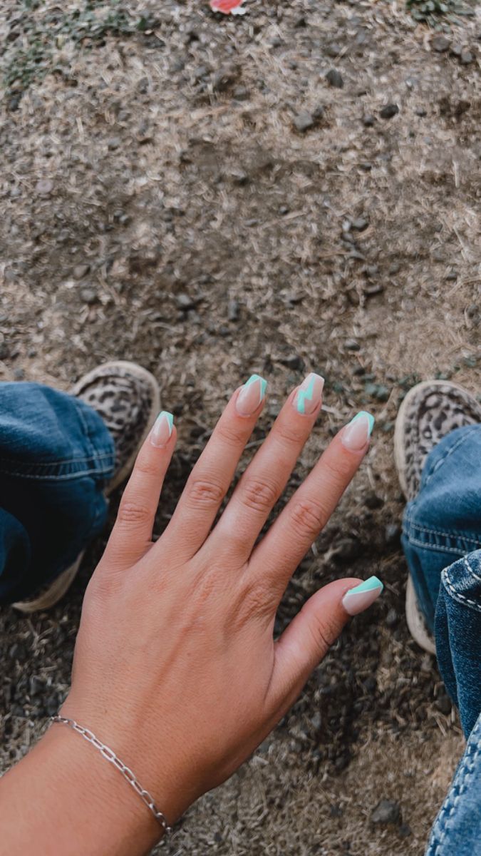 Chic Nail Design: Modern Geometric Patterns in Soft Nude and Mint Green Hues.