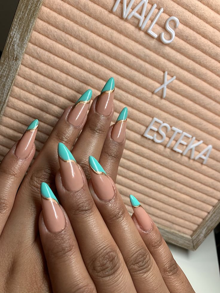 Chic Turquoise and Nude Nail Design with Elegant French Tips and Gold Accents.