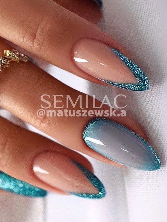 Sophisticated Stiletto Nail Design: Nude and Gray with Turquoise Glitter Tips