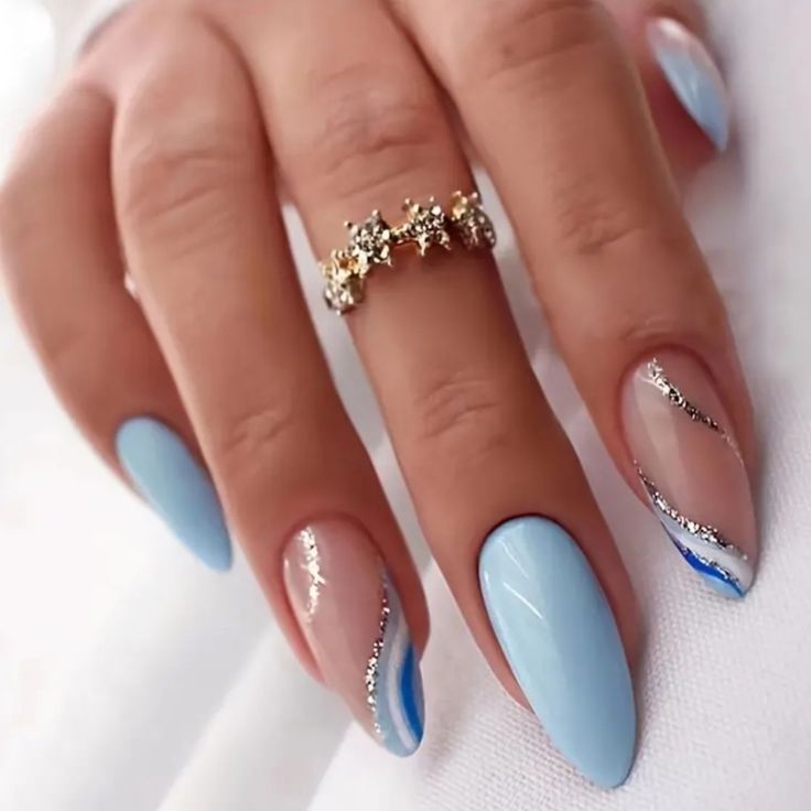 Sophisticated Soft Blue Nail Design with Glossy, Matte Finishes and Intricate Silver Accents.