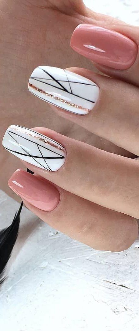 Chic Sophisticated Nail Design: Soft Pink, Crisp White, Black Lines, and Glittering Gold.