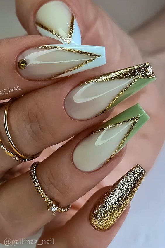 Sophisticated Pastel Nail Design with Gold Accents and Modern Geometric Patterns.