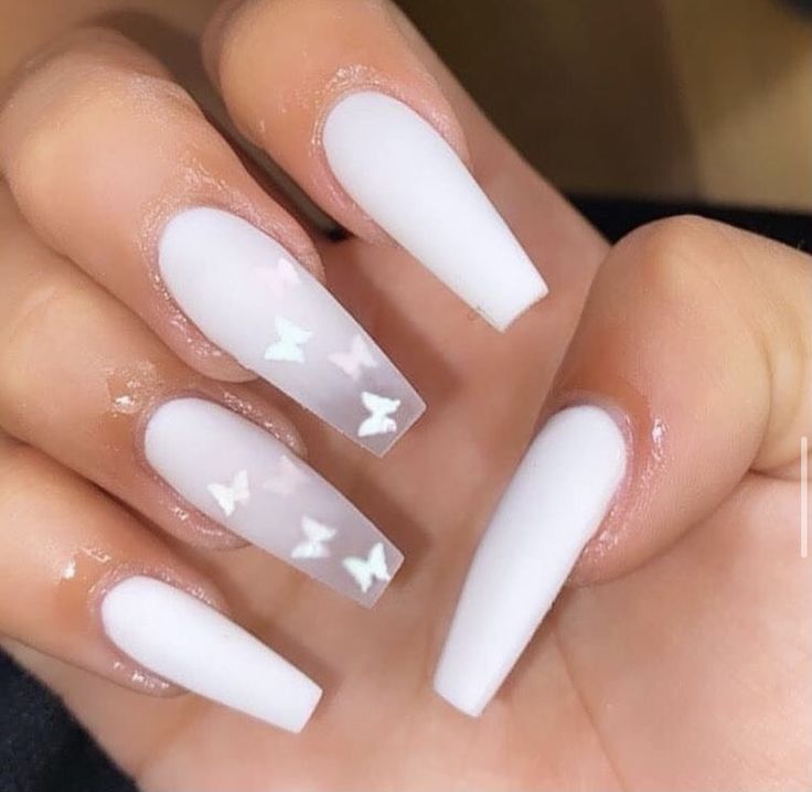 Chic Nail Design: Soft White Base with Glossy Butterfly Motifs